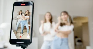 Two girls recording a dance on their phone